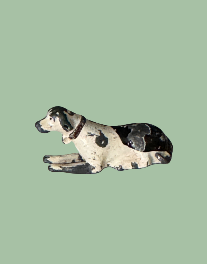 Dog figurine on a polka dot background