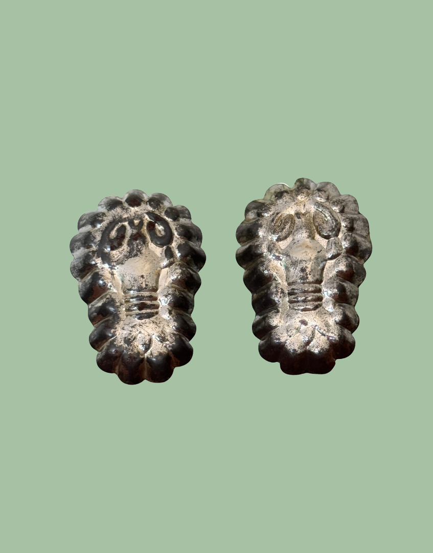 Matching pair of vintage lobster tinplate moulds displayed together as unusual European kitchenalia collectables