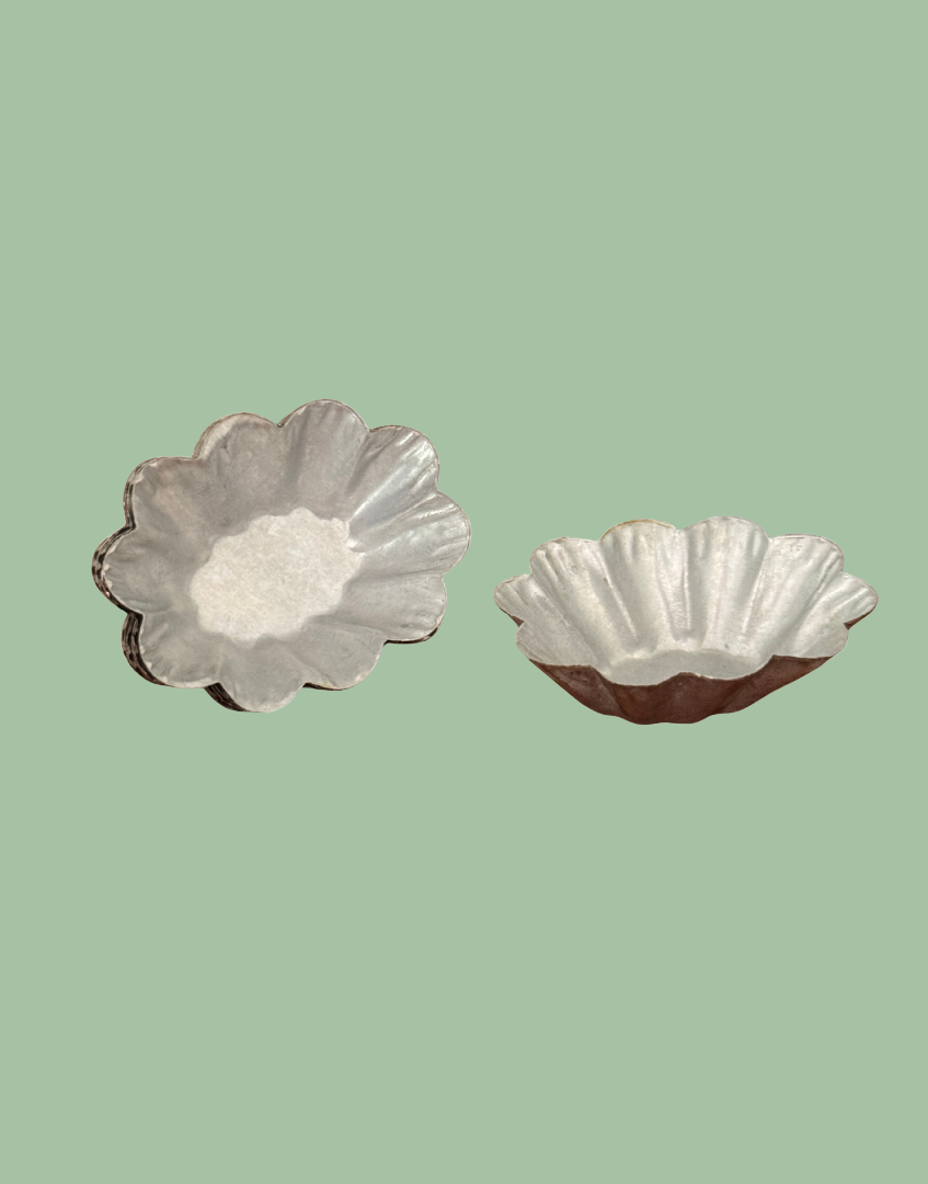Top view of a vintage fluted petit four mould showing delicate miniature size and traditional confectionery design