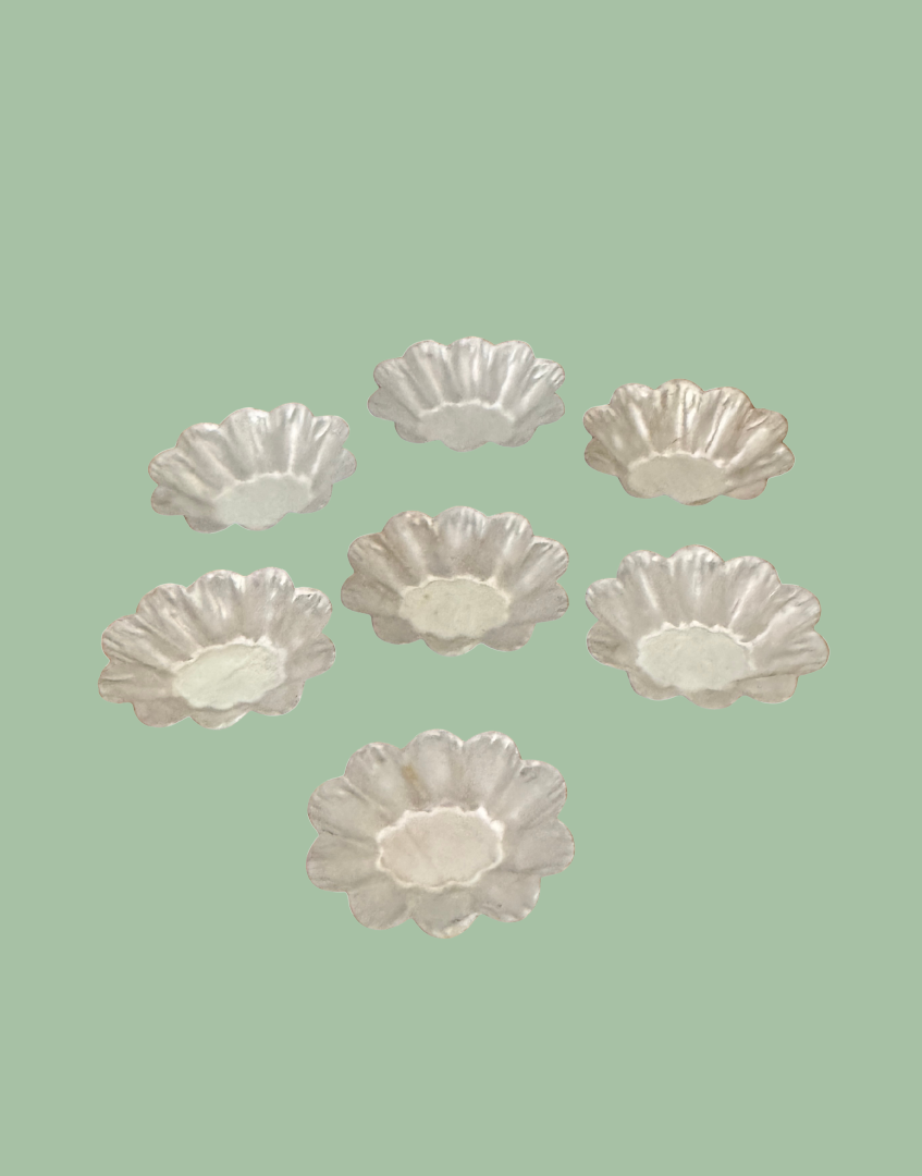Top view of vintage fluted petit four mould set showing the complete collection and decorative mould shapes