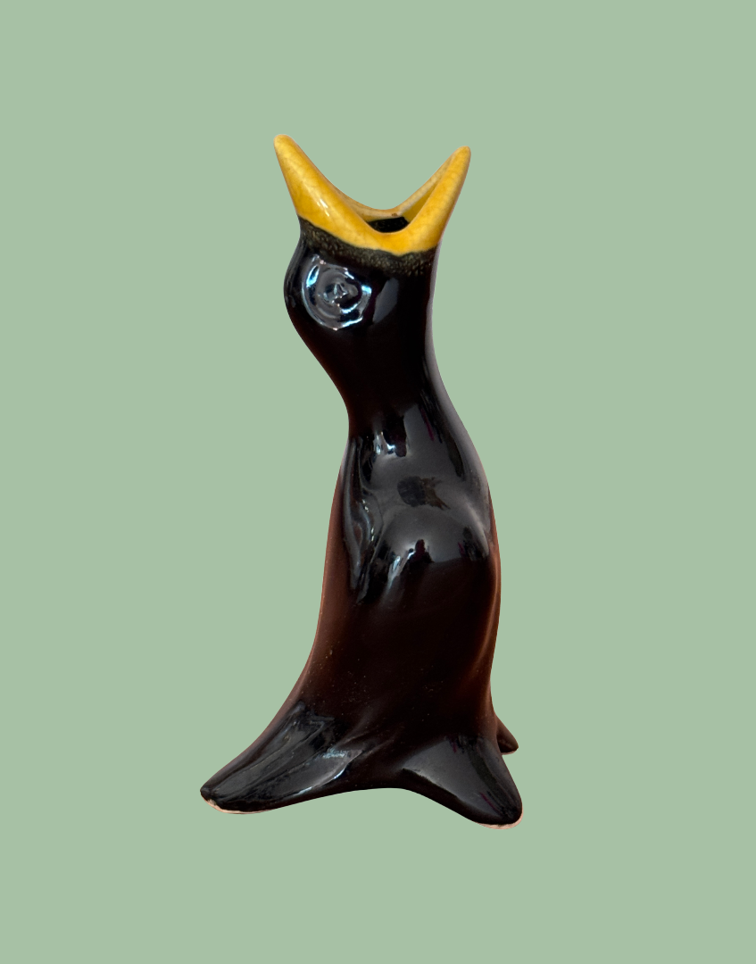 Decorative classic vintage pie funnel shaped as a black bird