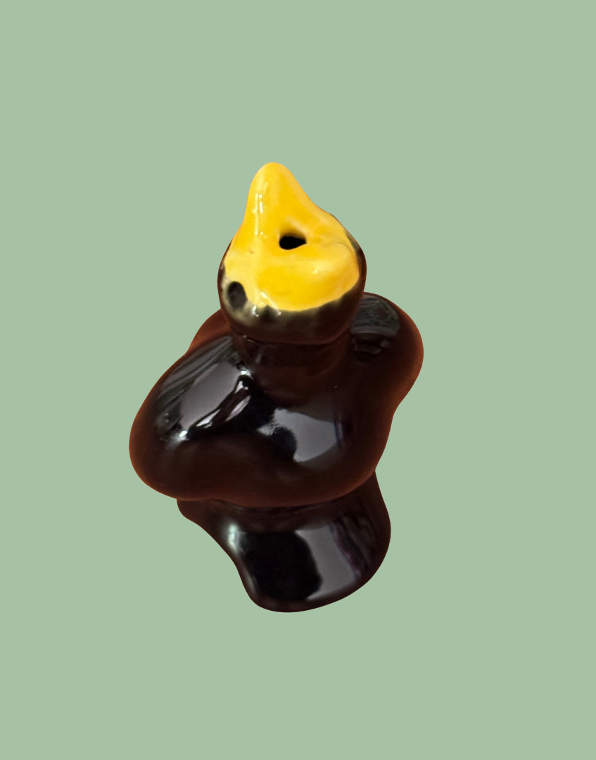 Overhead view of yellow beak and pie bird hole vent baking tool