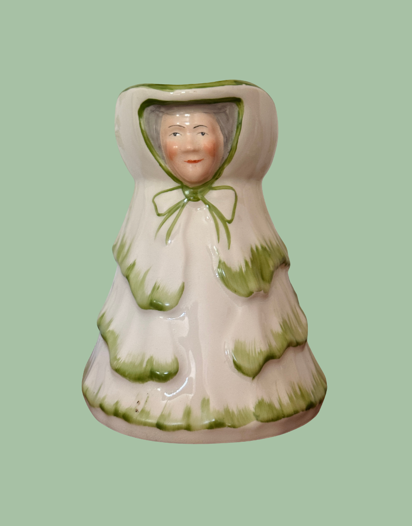 Front view of Tony Wood Little Old Lady green large jug with character face and bonnet detailing