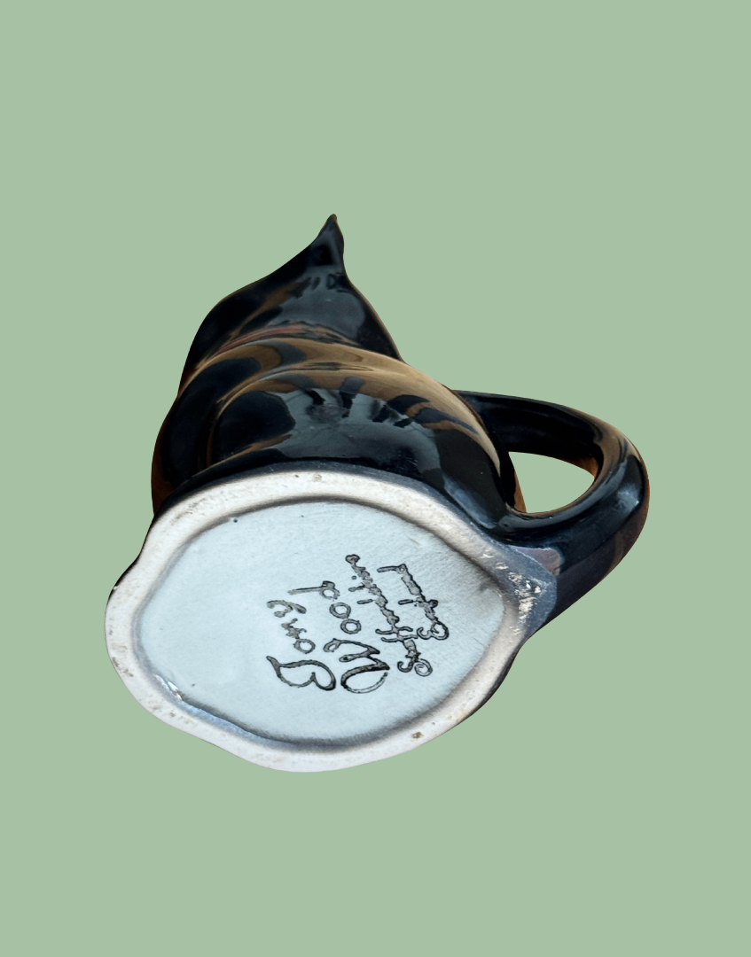 Base of black ceramic vintage car shaper milk jug with Tony Wood Staffordshire England maker stamp