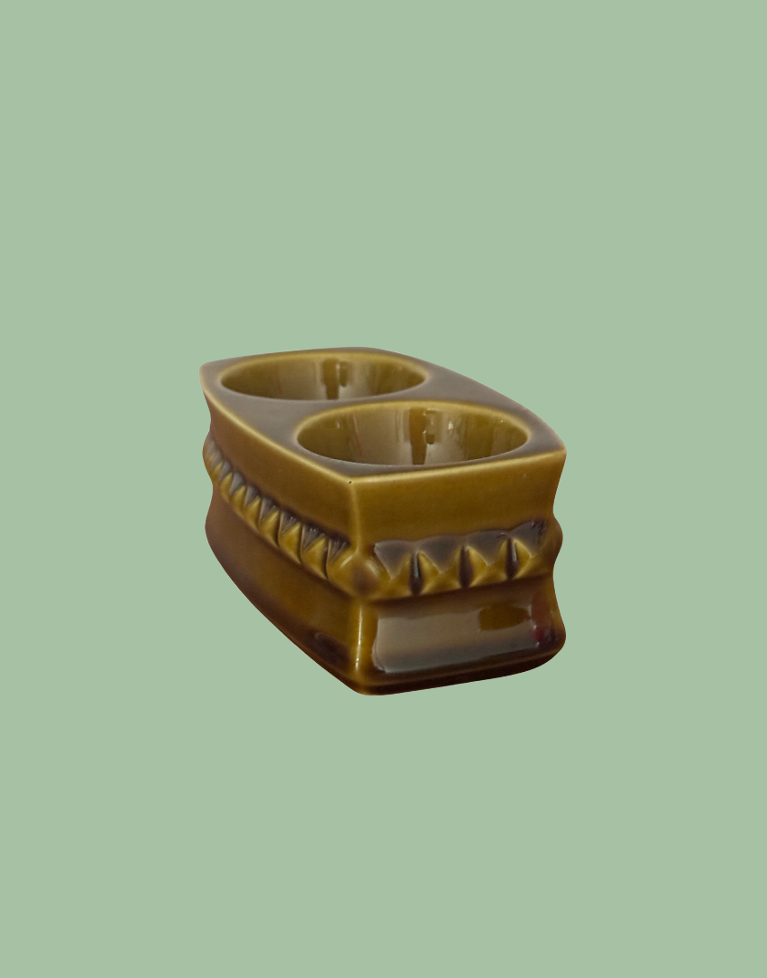 side view of dapper style vintage 1930s double egg cup