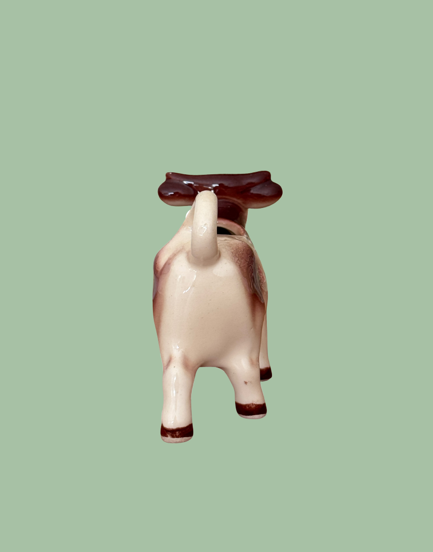 Rear view of cow creamer with tail as handle