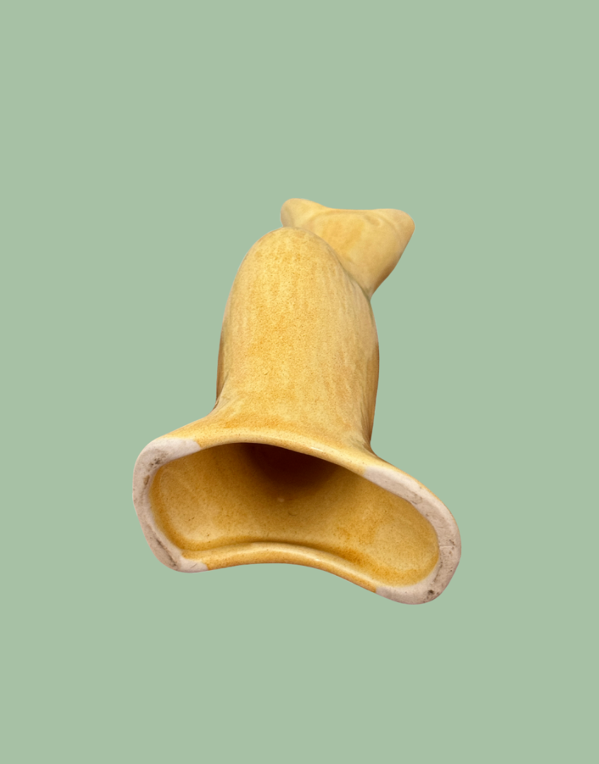 Base view of classic yellow vintage pie bird baking tool