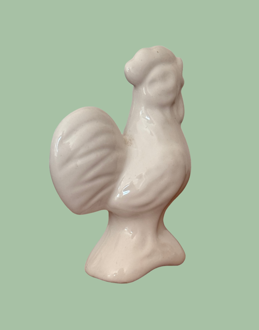Back side view of white bird shaped pie vent