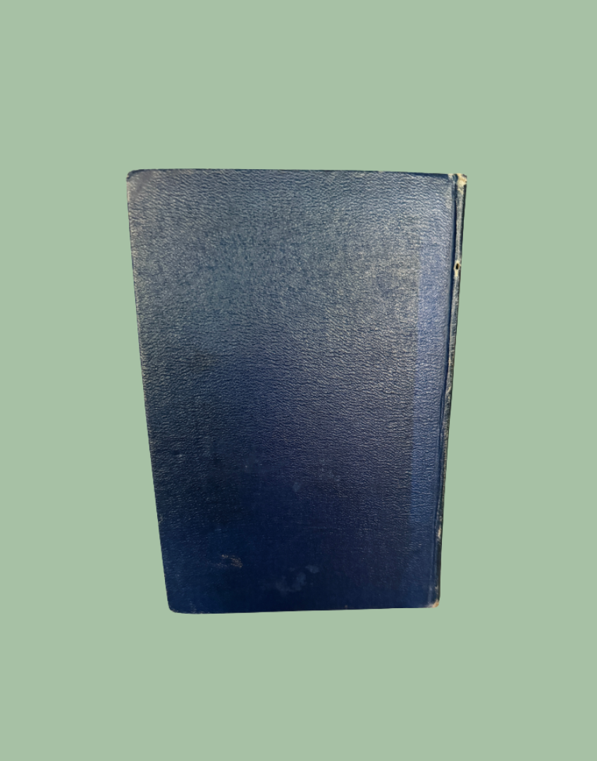 Back cover of antique 1927 Natural History Animals book showing navy blue leather binding and aged finish
