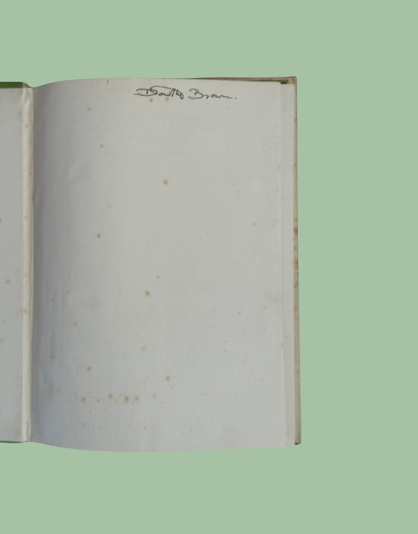 Inside front cover of Wild Life of Britain vintage book showing handwritten ownership name and condition