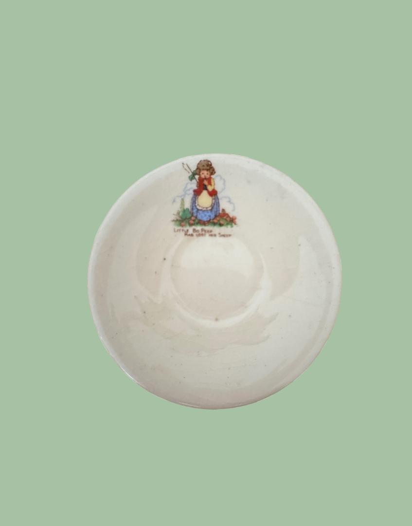 vintage childs playset saucer with nursery illustration