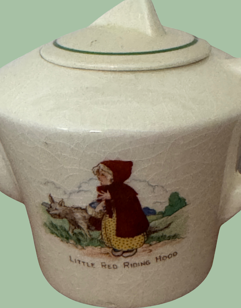 close up of little red riding hood decoration on 1940s childs play teapot