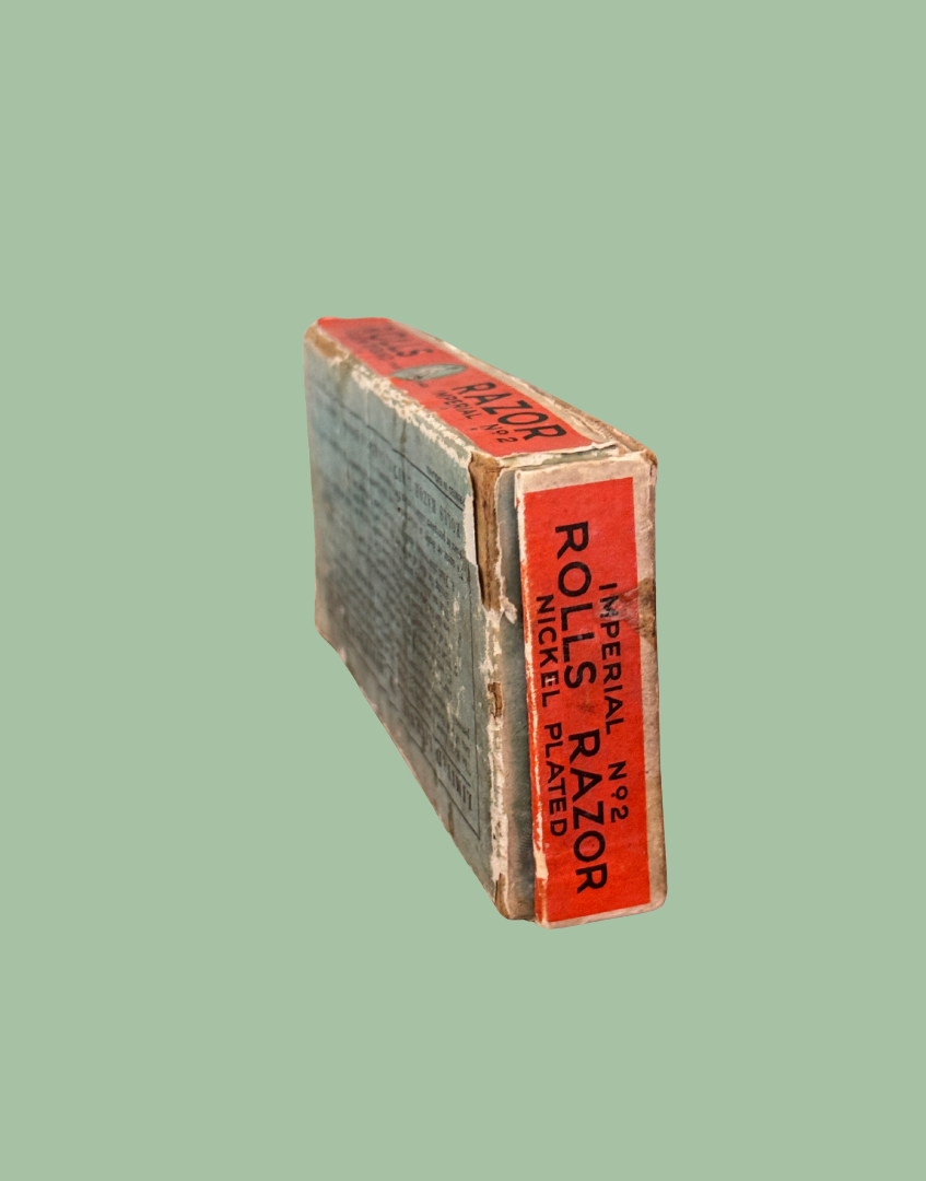Red and black vintage razor pack on side showing typography