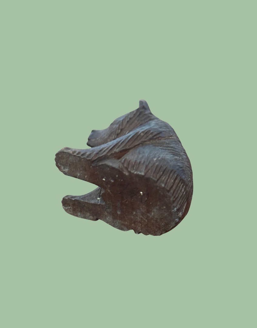 Small Black Forest bear carving base view underside worn wood