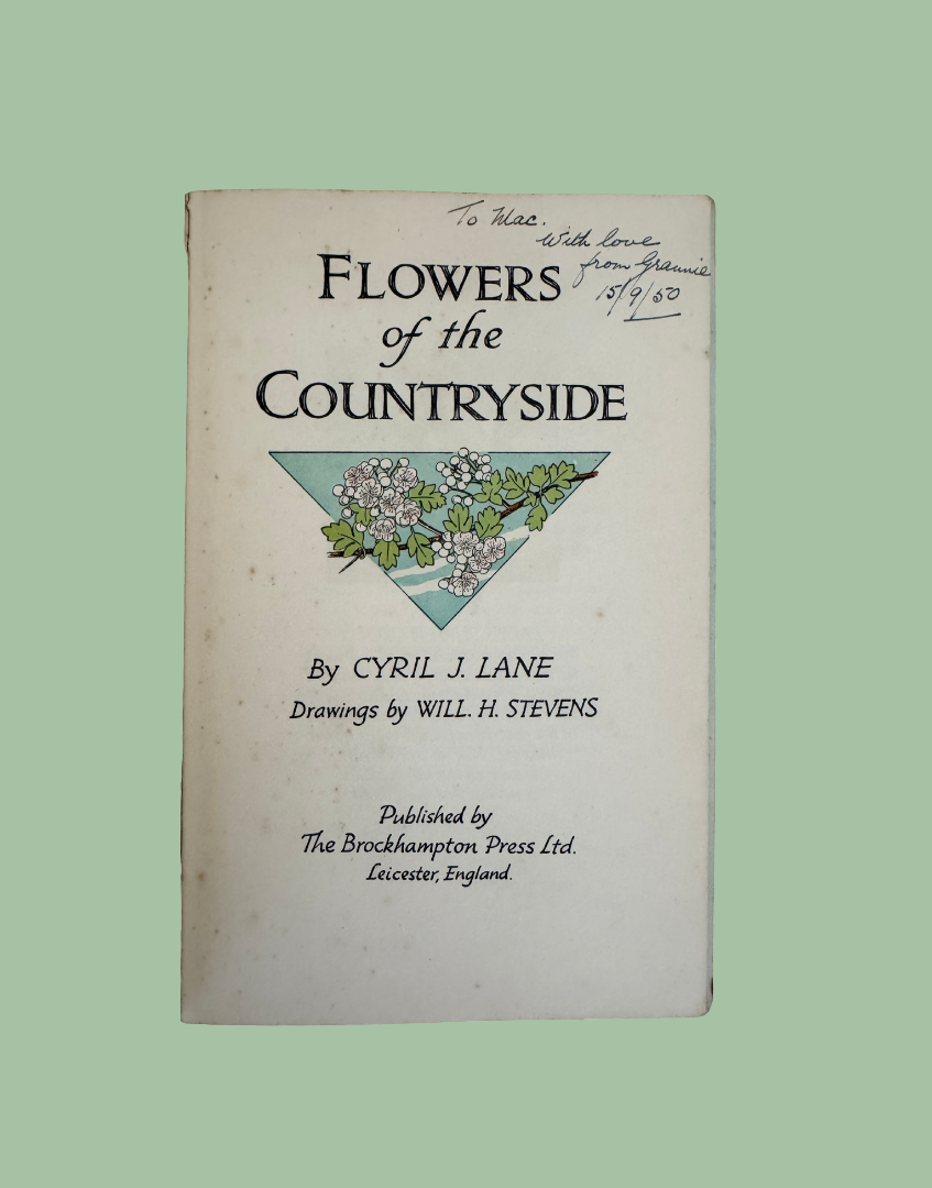 Vintage book showing handwritten 1950 gift inscription inside the front cover.