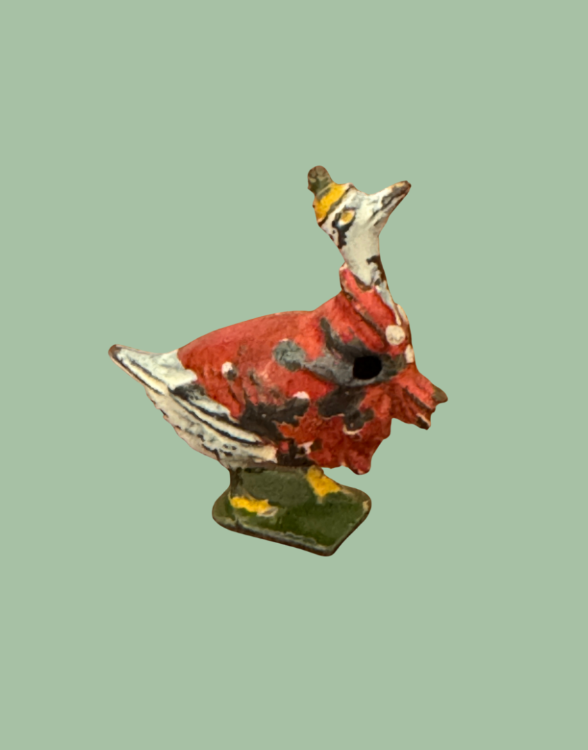 brightly painted in red, white and yellow britains vintage cadbury cococub bird collectable