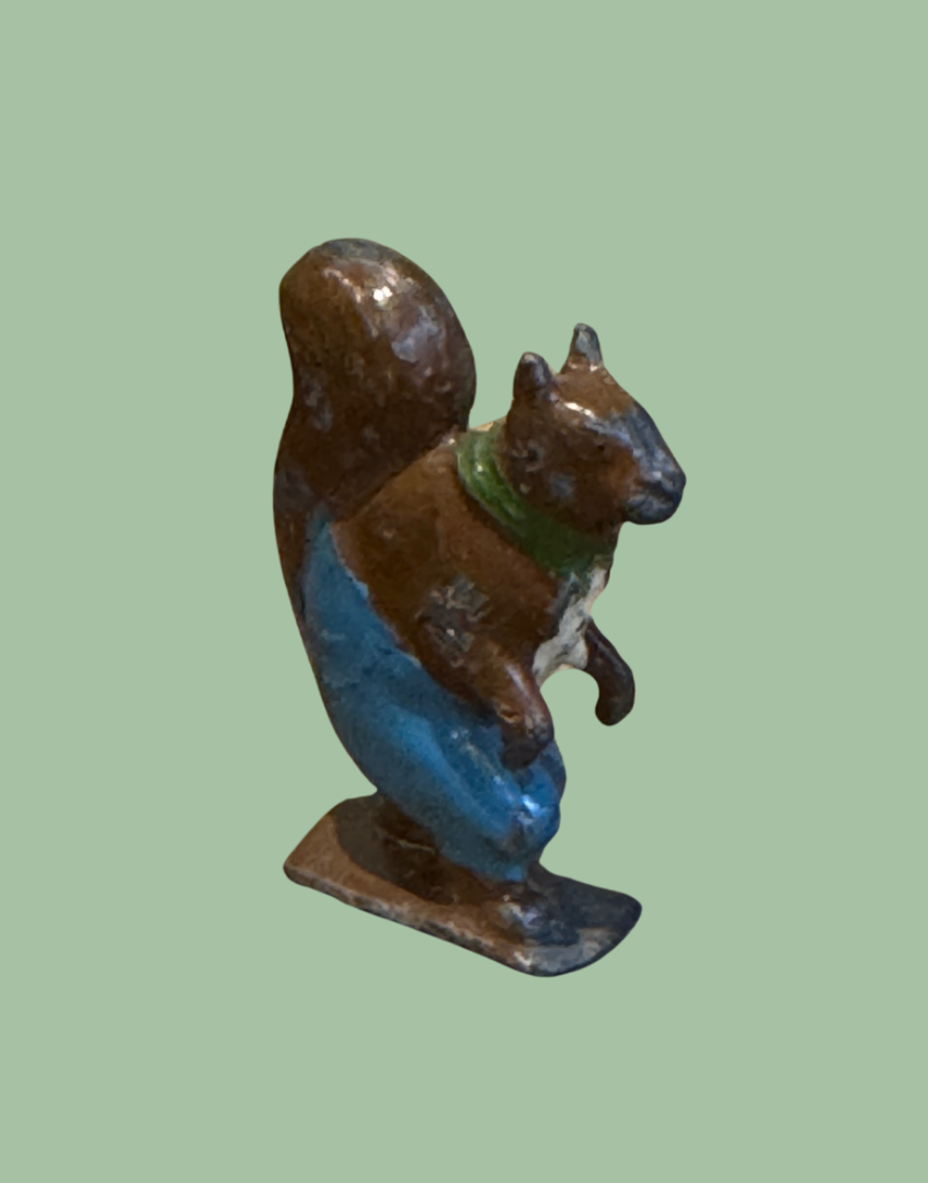Front side view of vintage lead Nutty Squirrel Britains Cadbury Cococub miniature figure