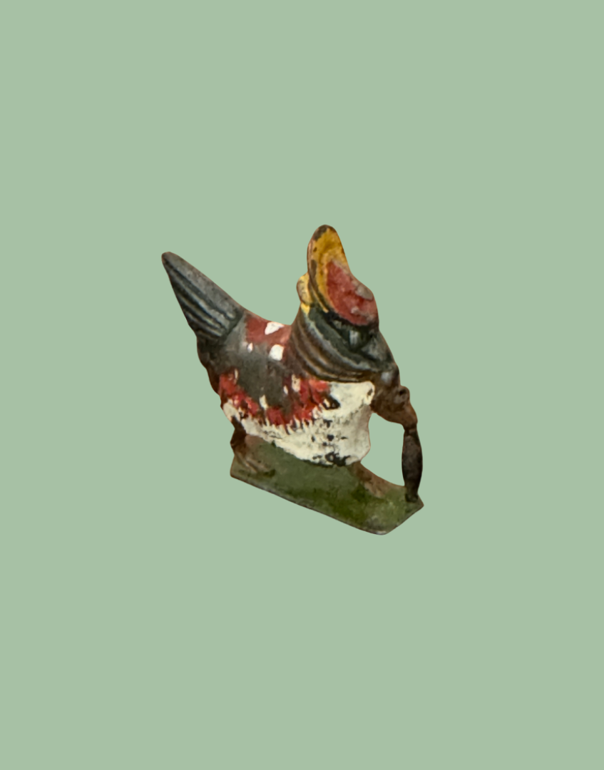 front side view of cadbury cococub britains collectable hen figurine with bonnet and umbrella on stand