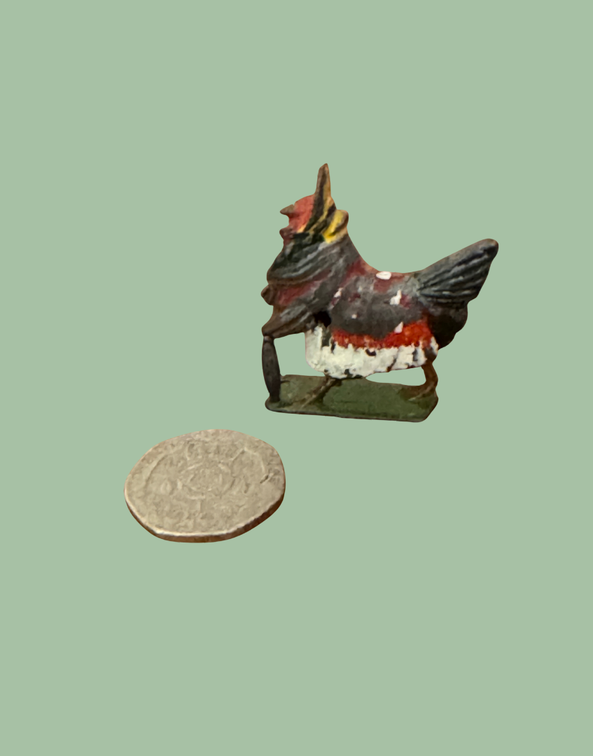 Henrietta ‘Fussy Feathers’ Britains Ltd Collectable next to twenty pence coin for scale