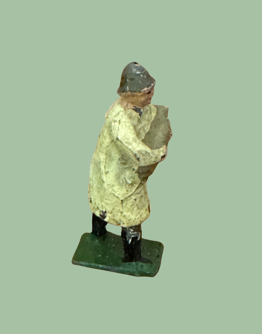 Side View of Vintage British Farmer Carrying Light Grey Sheep in Beige Raincoat 1920s Britains Lead Farmyard Toy