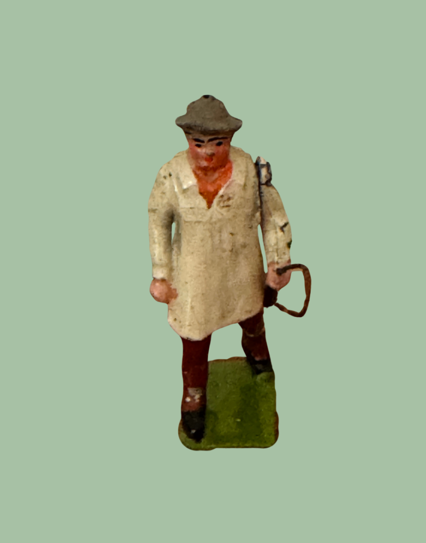 Original 1930s Britains Carter with Whip miniature farm figure wearing tan smock and country hat