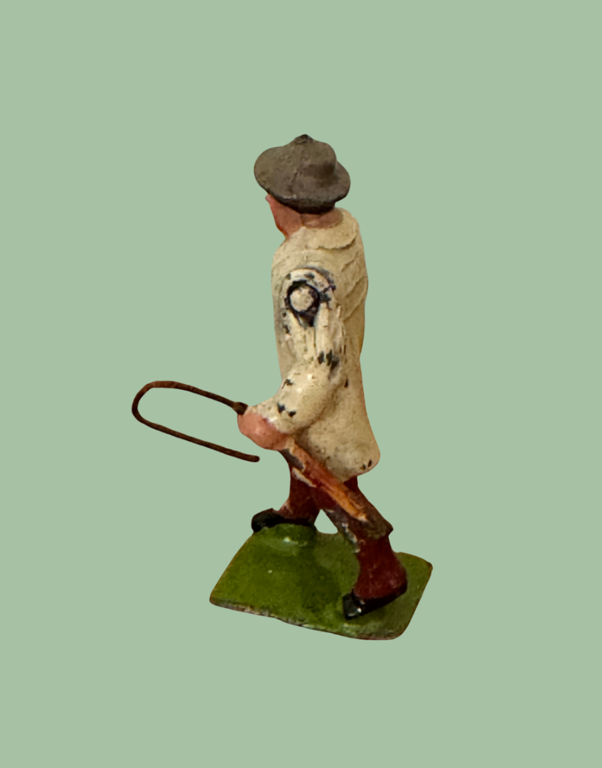 Side view of Britains 1930s Carter with Whip lead farm figure showing articulated arm and painted detailing