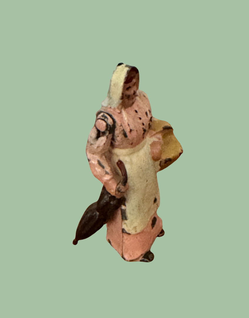Side view of Britains 1930s Wife with Umbrella articulated arm lead figure showing pink dress and umbrella