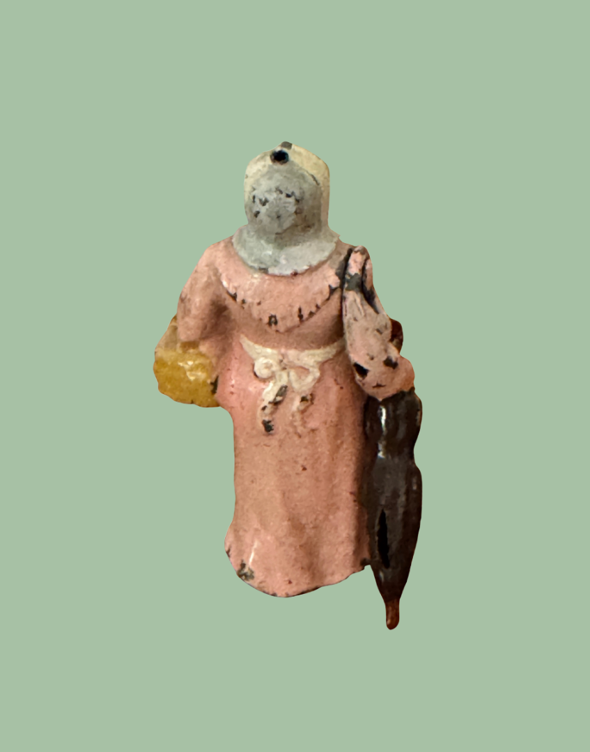 Rear view of Britains Wife with Umbrella vintage Home Farm Series lead figure showing bonnet and painted detailing