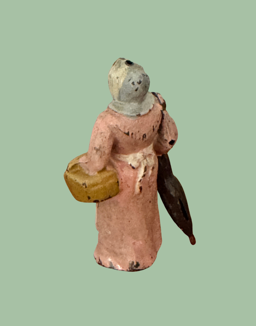 Three-quarter rear view of Britains 1930s Wife with Umbrella lead farm figure with articulated swivel arm
