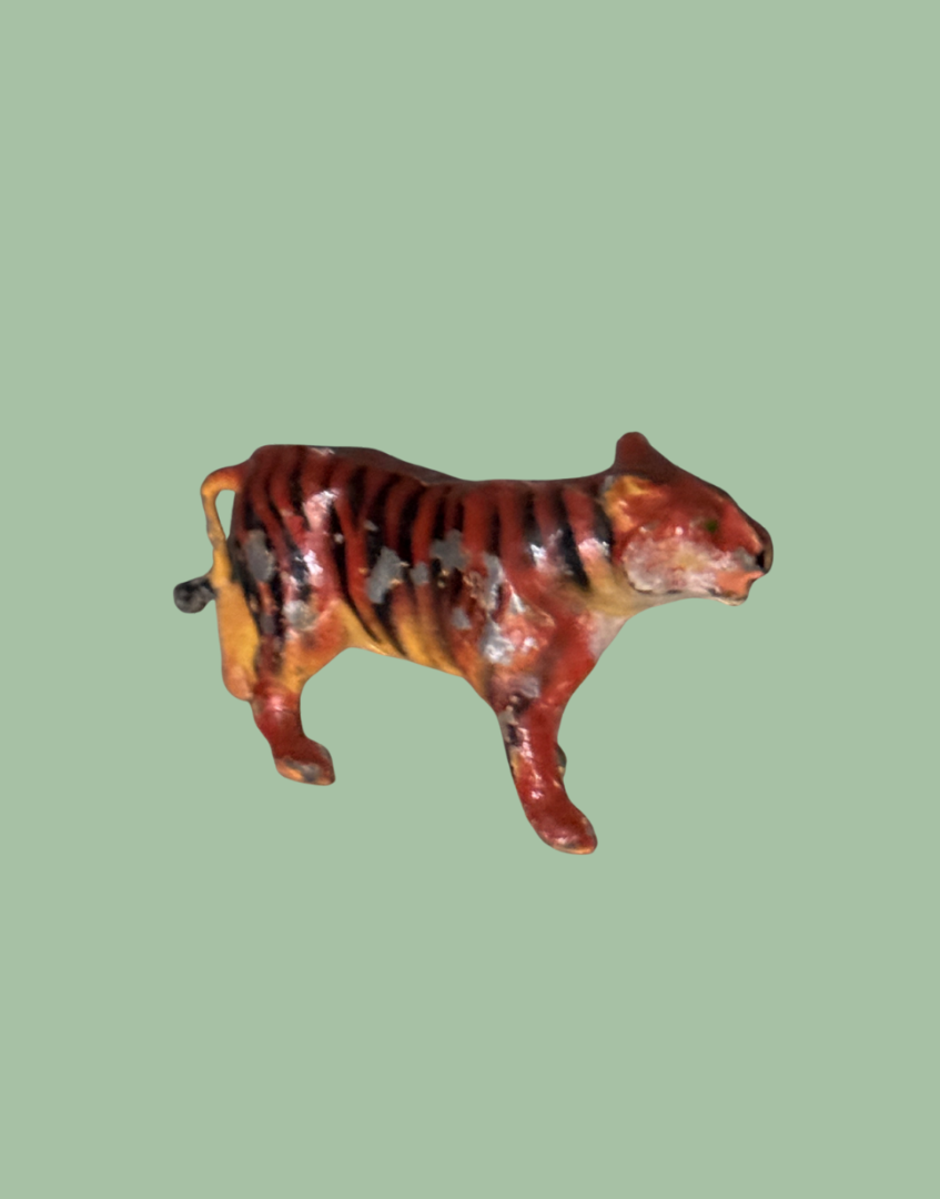 Tiger figurine on a polka dot background