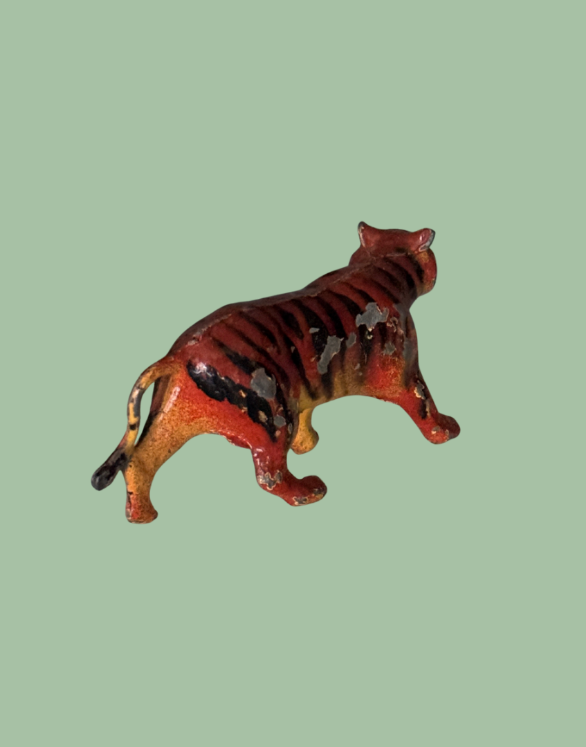 Britains collectable lead tiger figurine on a polka dot background