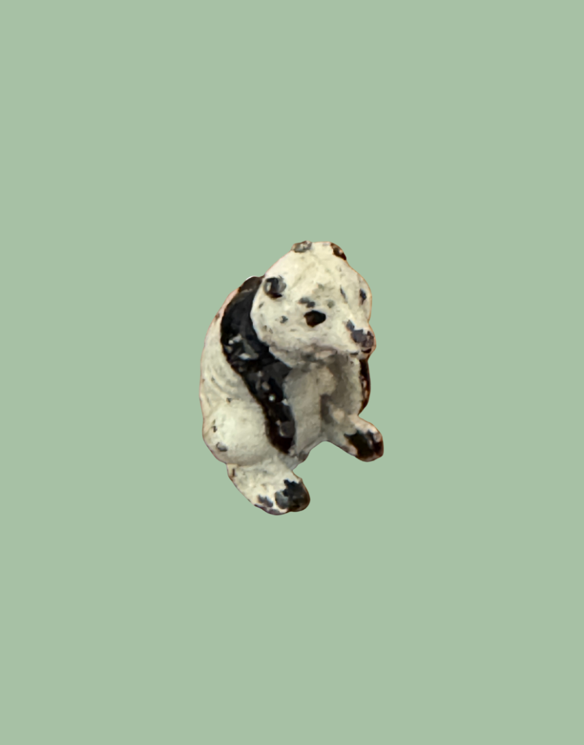side view of sweet vintage panda lead figurine