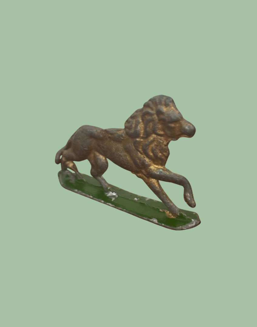 front facing vintage metal lion figurine