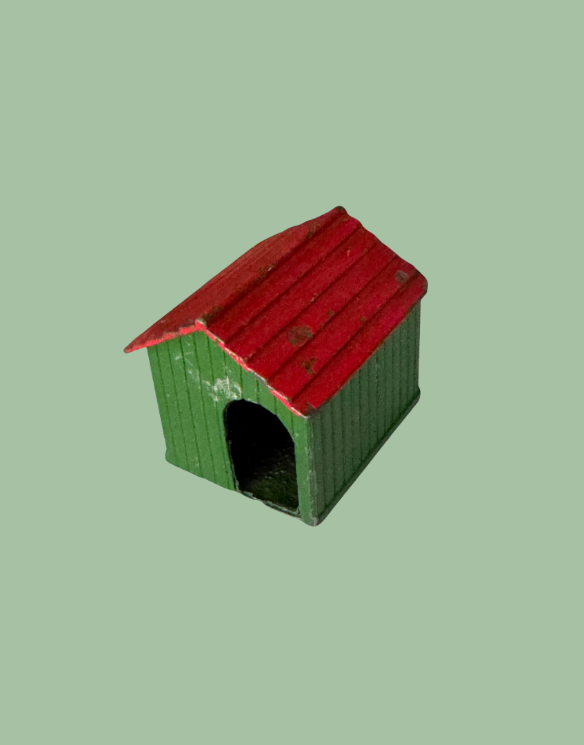 Small green and red hand painted lead toy dog kennel