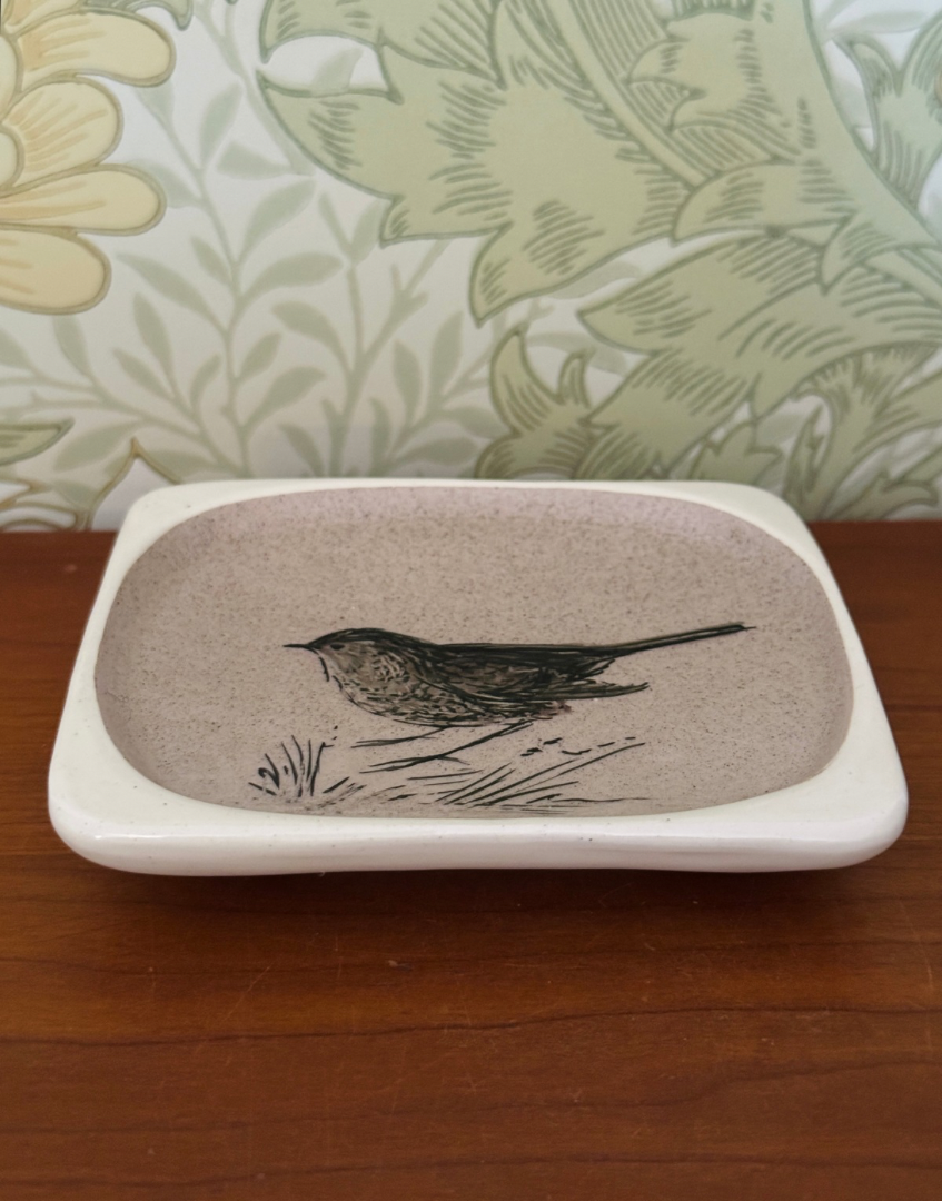 Front view of porcelain glazed wren illustrated trinket dish