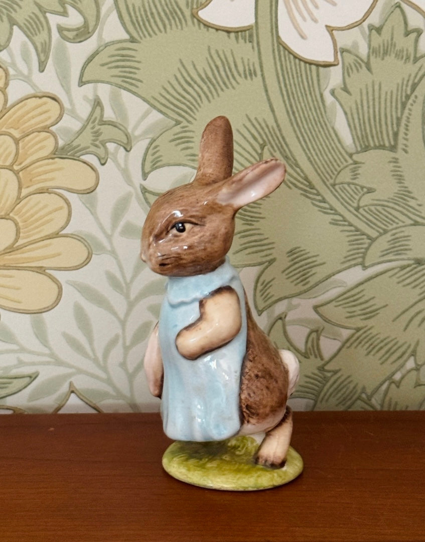 Beswick Mrs Flopsy Bunny Beatrix Potter figurine displayed on a wooden shelf 