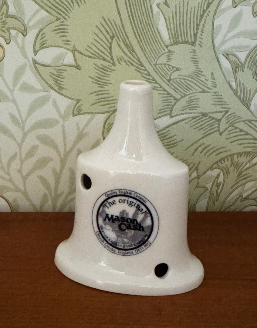 Side view of white trditional Mason Cash pie vent collectable