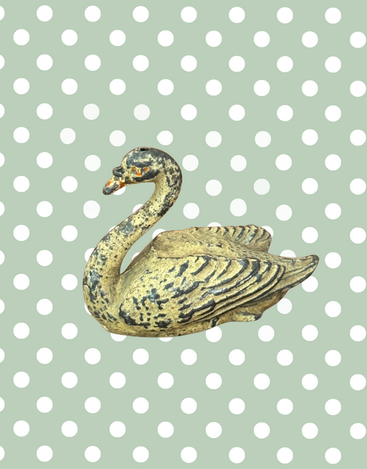 A cream swan swimming, version 2, showing some paint loss but retaining delicate shape and charm. This 1920s Britains figure is an ideal addition for collectors completing a vintage farmyard or waterfowl display.