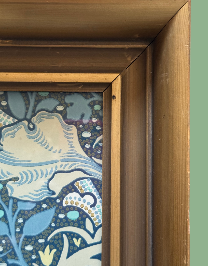 Close up of William Morris Seaweed framed wall art in vintage gold wood frame portrait orientation