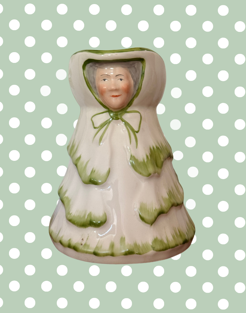 Front view of Tony Wood Little Old Lady green large jug with character face and bonnet detailing