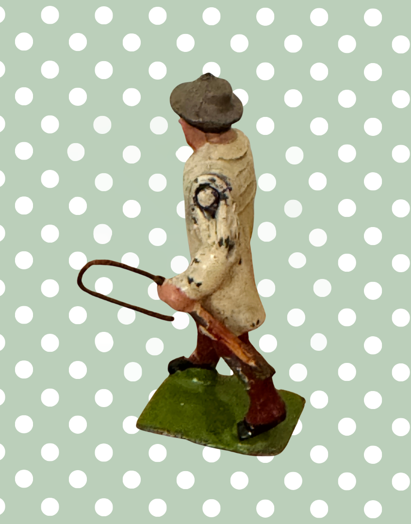 Side view of Britains 1930s Carter with Whip lead farm figure showing articulated arm and painted detailing