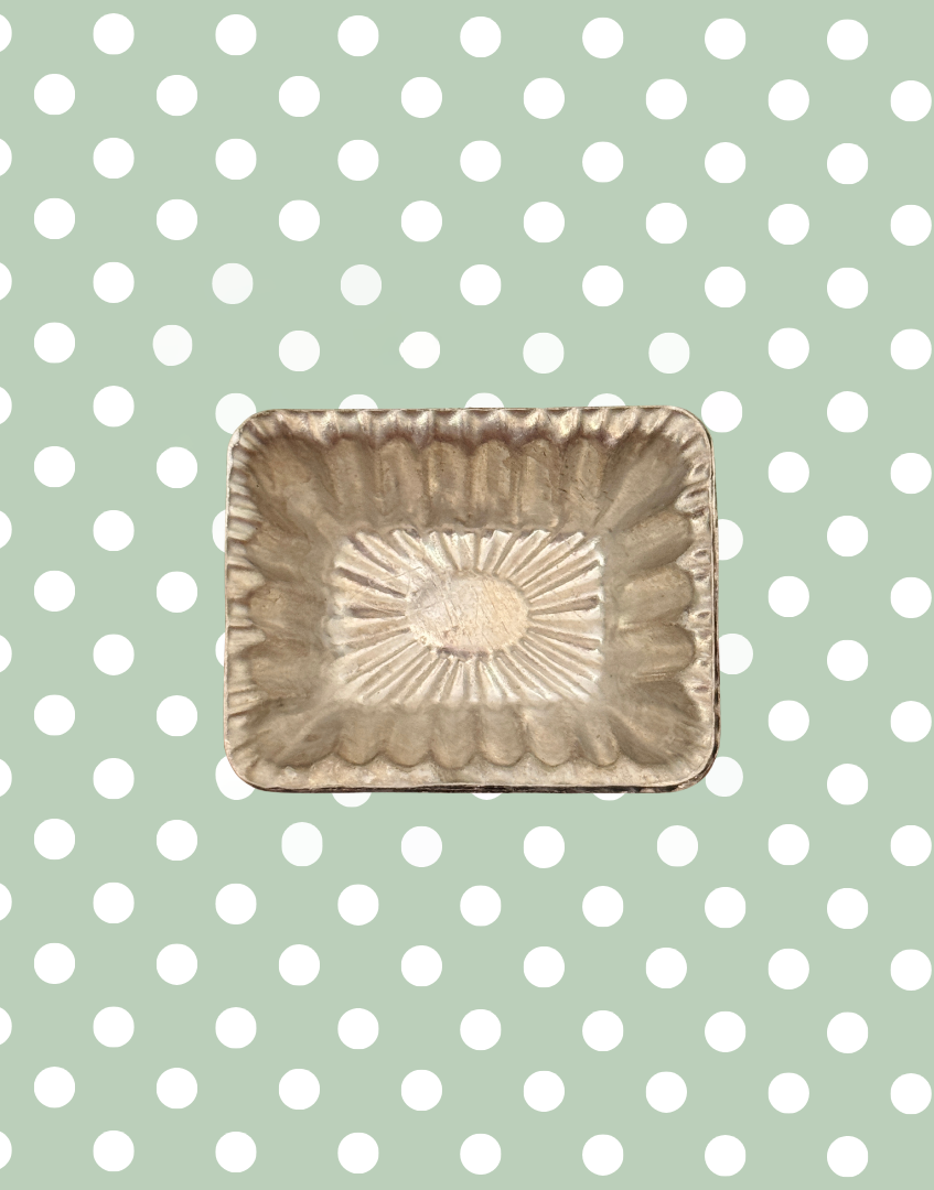 One out of a set of 10 identical vintage rectangular aluminium chocolate moulds with fluted sunburst design and original confectionery details
