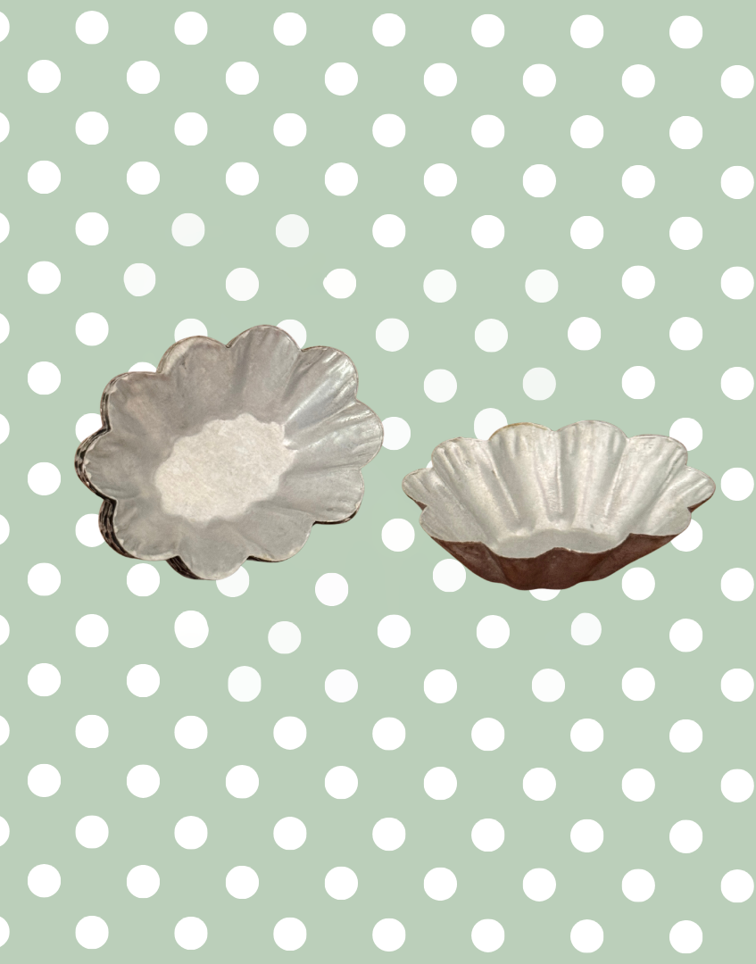 Top view of a vintage fluted petit four mould showing delicate miniature size and traditional confectionery design