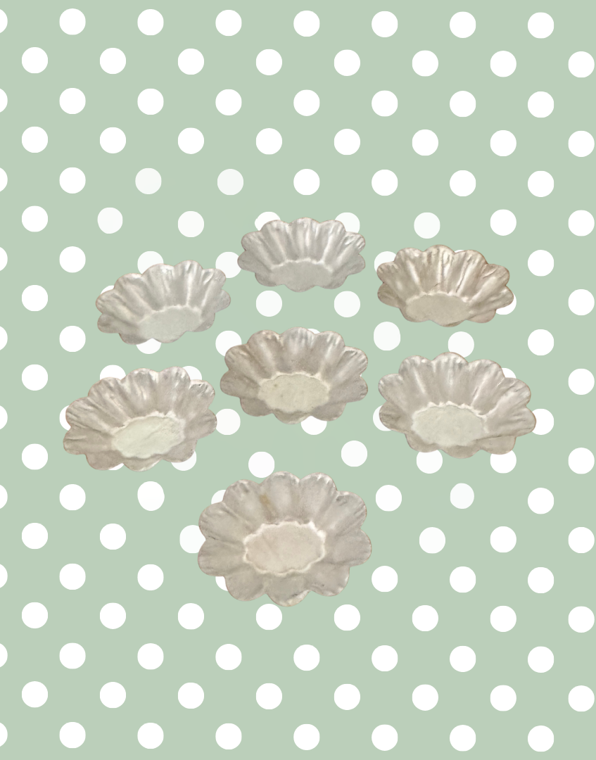Top view of vintage fluted petit four mould set showing the complete collection and decorative mould shapes