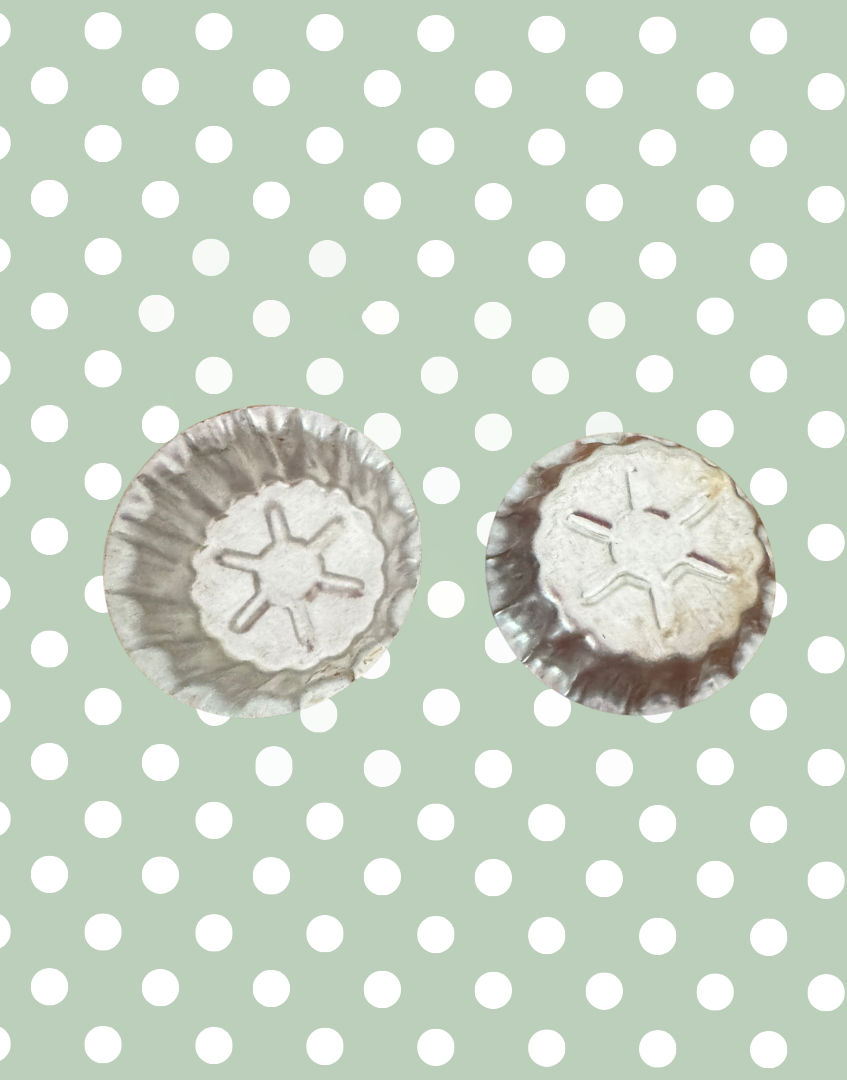 Vintage aluminium star mould showing front fluted design and reverse embossed star detail from a European kitchenalia collection
