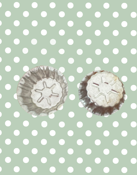 Vintage aluminium star mould showing front fluted design and reverse embossed star detail from a European kitchenalia collection