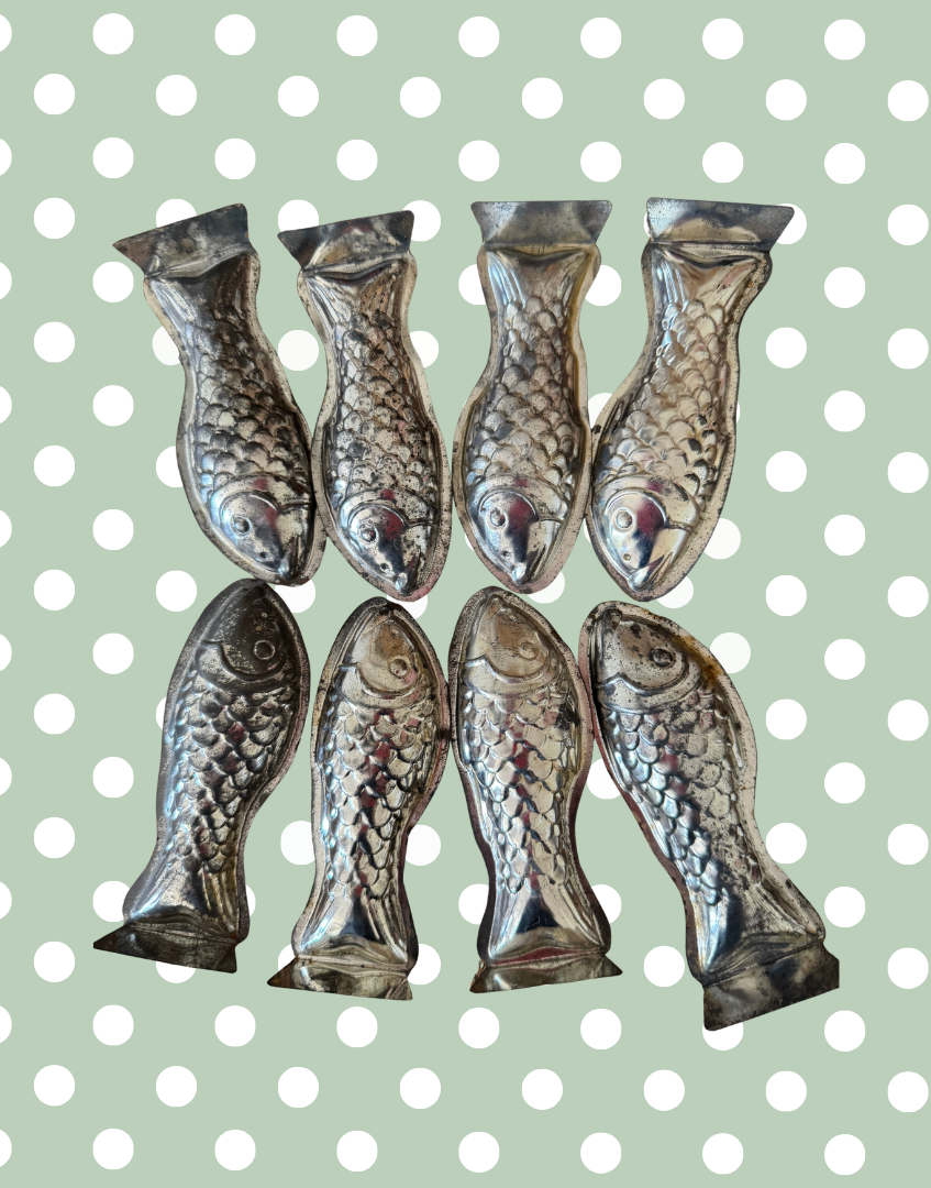Collection of eight vintage fish shaped aluminium moulds from a set of ten European kitchenalia collectables