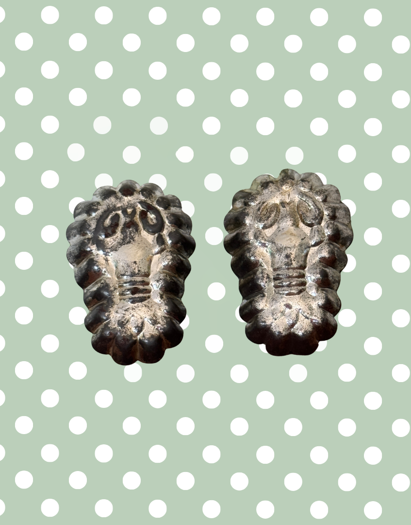 Matching pair of vintage lobster tinplate moulds displayed together as unusual European kitchenalia collectables