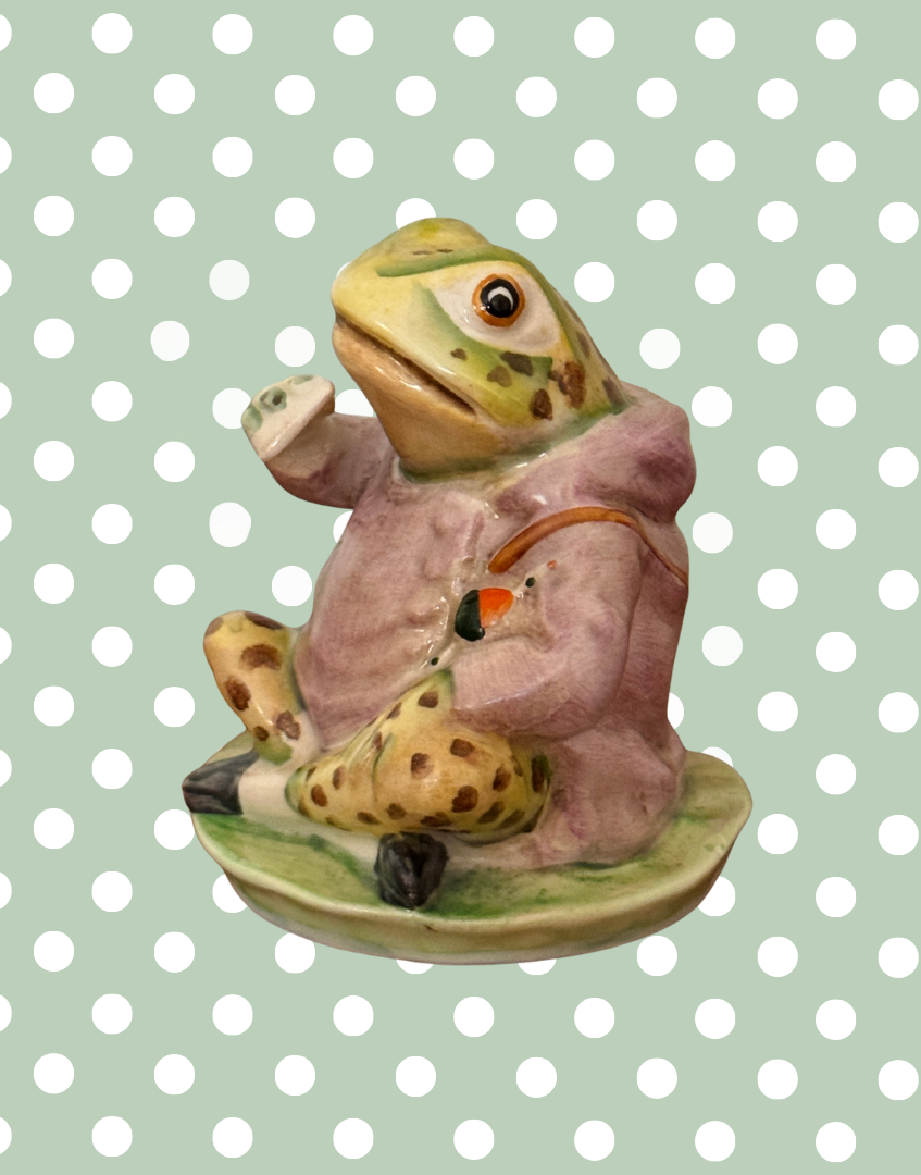 Side view of Beswick Jeremy Fisher figurine holding and eating a sandwich, with beautifully hand-painted coat and character details