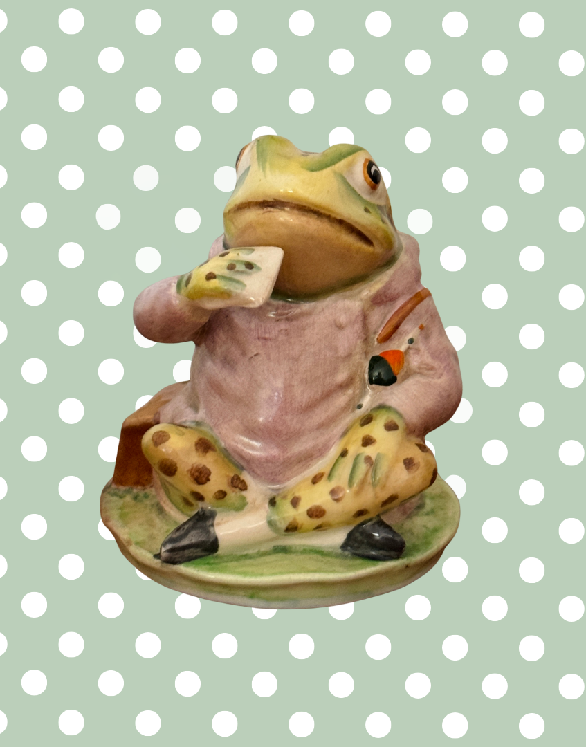 Side view of vintage Beswick Jeremy Fisher figurine showing hand-painted details and green frog character